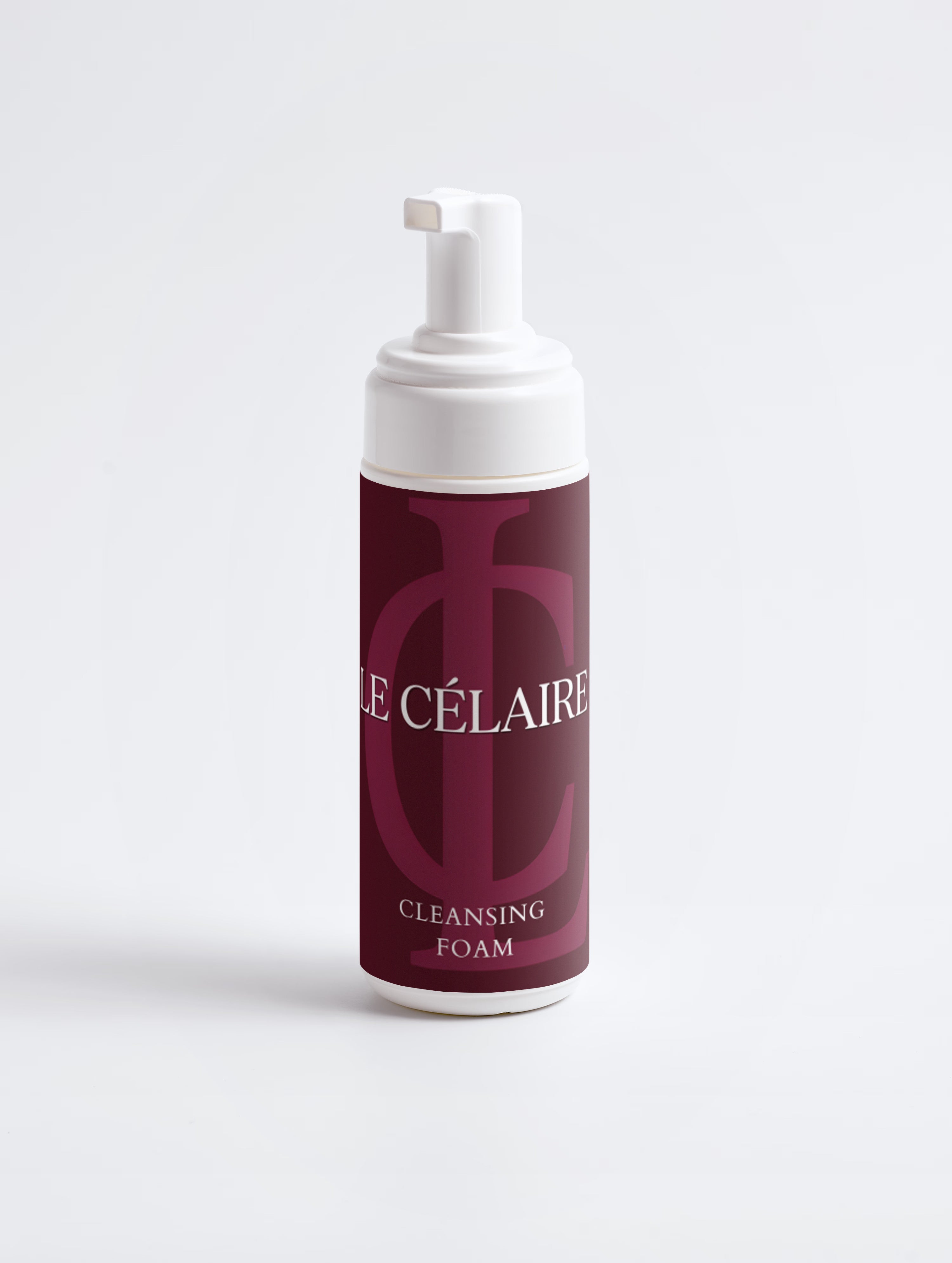 A bottle of Cle Célaire Cleansing Foam with a white pump dispenser and a deep burgundy label, set against a clean white background.