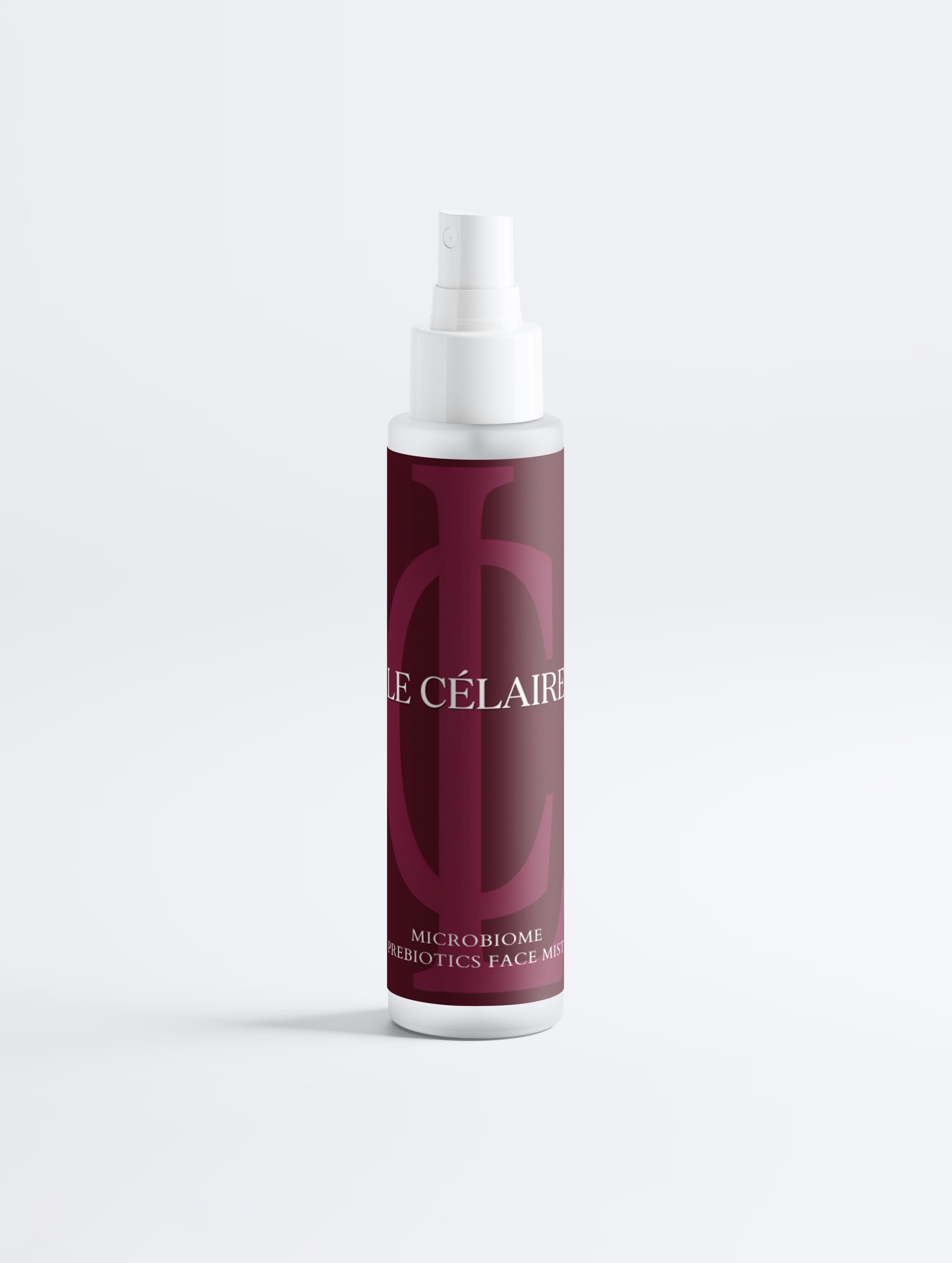 A bottle of Le Célérier Microbiome Face Mist with a white spray top and a deep burgundy label featuring a large monogram logo.