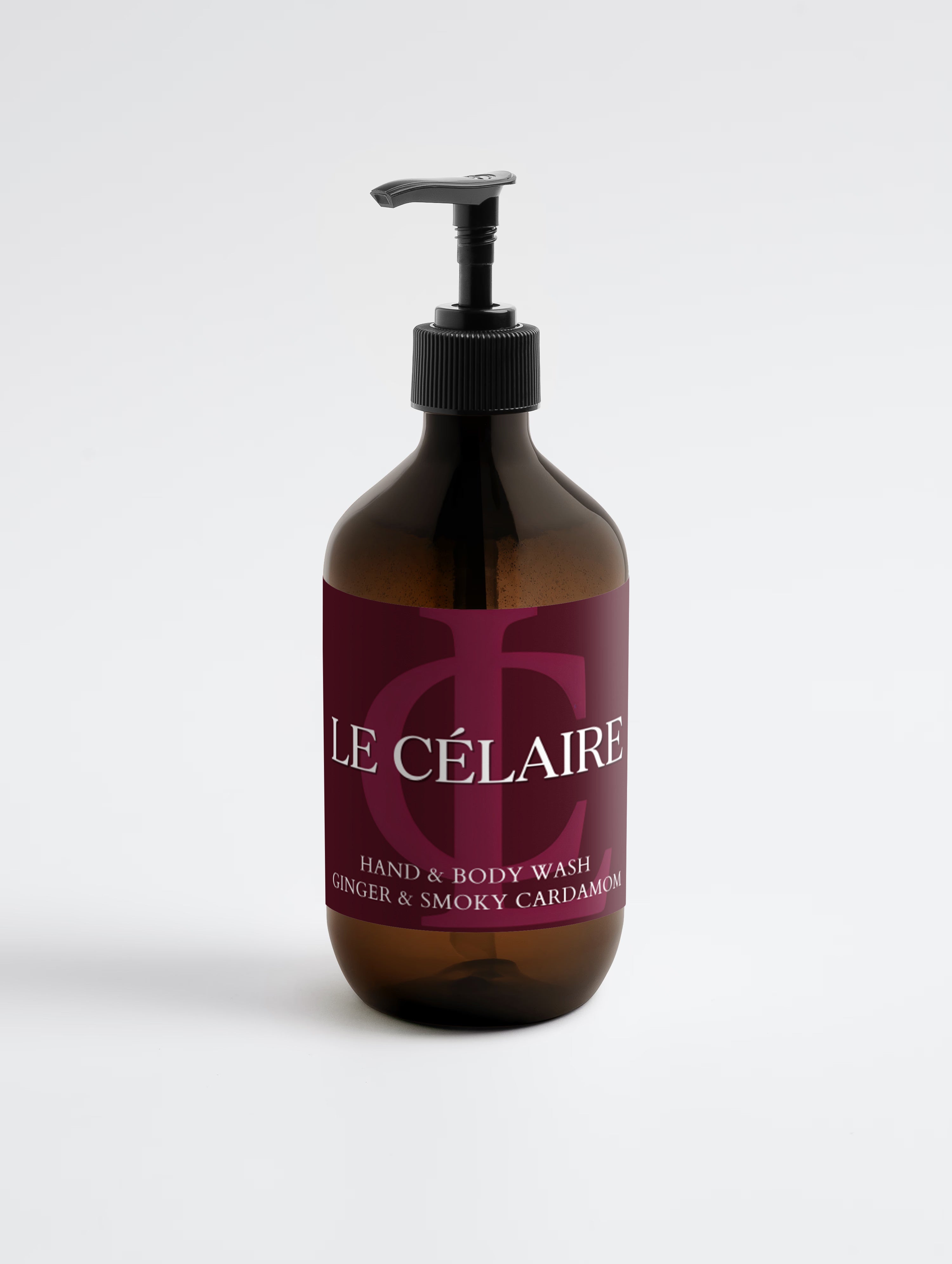 A bottle of Le Célaire Hand & Body Wash in a dark amber glass bottle with a black pump dispenser and a deep burgundy label, set against a clean white background.