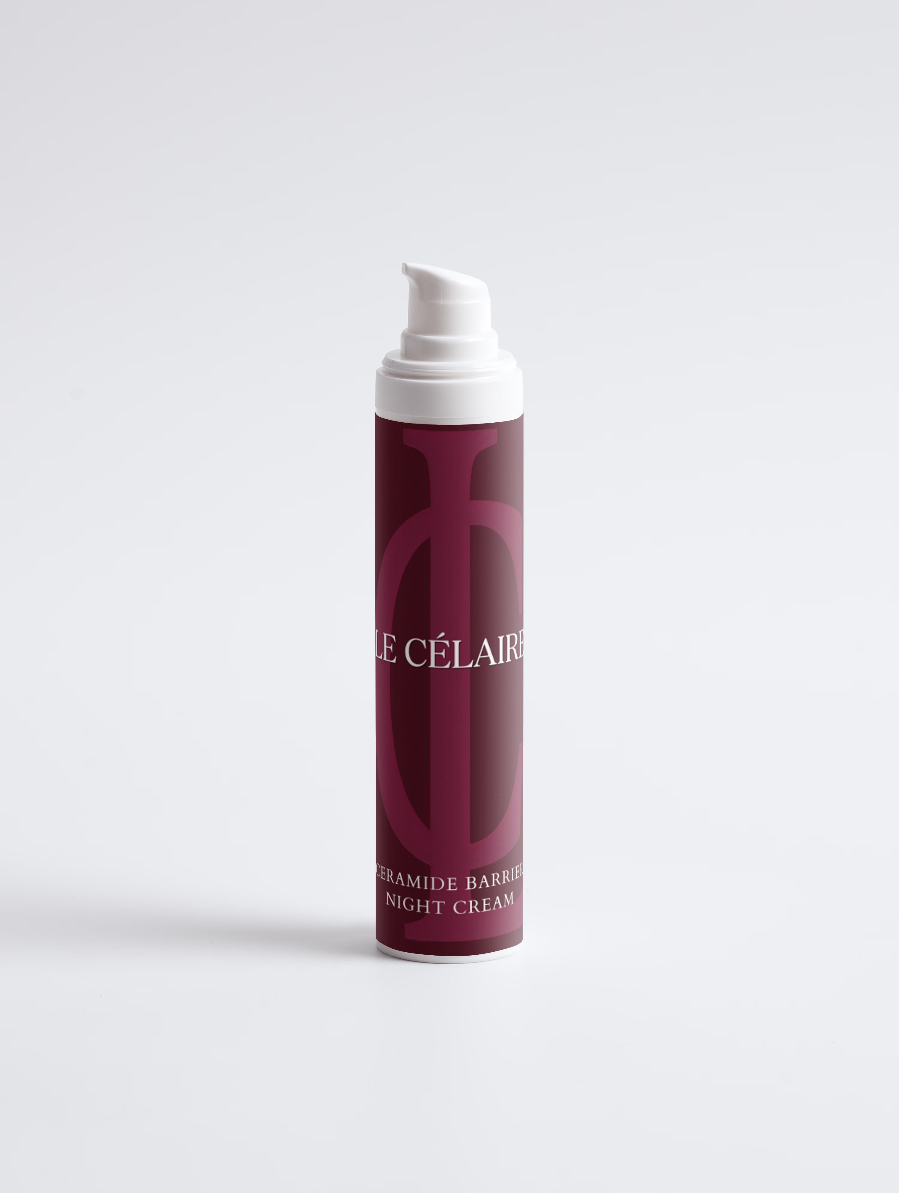 A single cylindrical cosmetic pump bottle standing upright on a clean white studio background. The bottle has a deep burgundy label with a large tonal monogram and white text reading 'CÉLAIRES' and 'GRAMIDE BARRIER NIGHT CREAM.