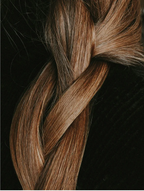 Close-up of a beautiful braid with shiny, healthy hair, showcasing natural texture and color.
