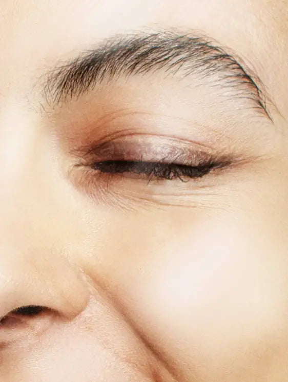 Close-up of an eye with makeup on a blurred background