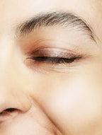 Close-up of an eye with makeup on a blurred background