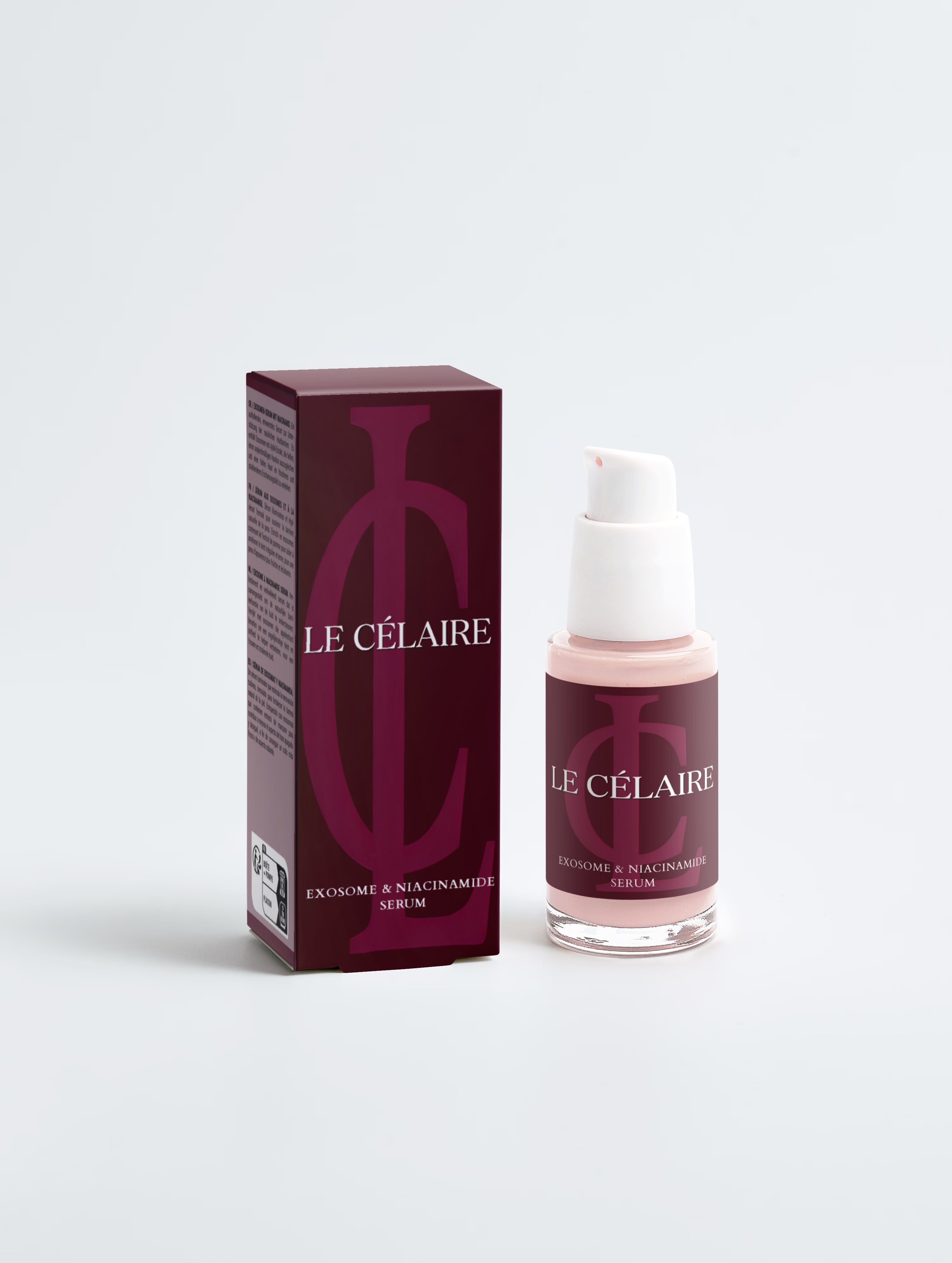 A bottle of liquid foundation with a white pump and a matching magenta-purple label, standing next to its tall magenta-purple retail box on a clean light gray background.