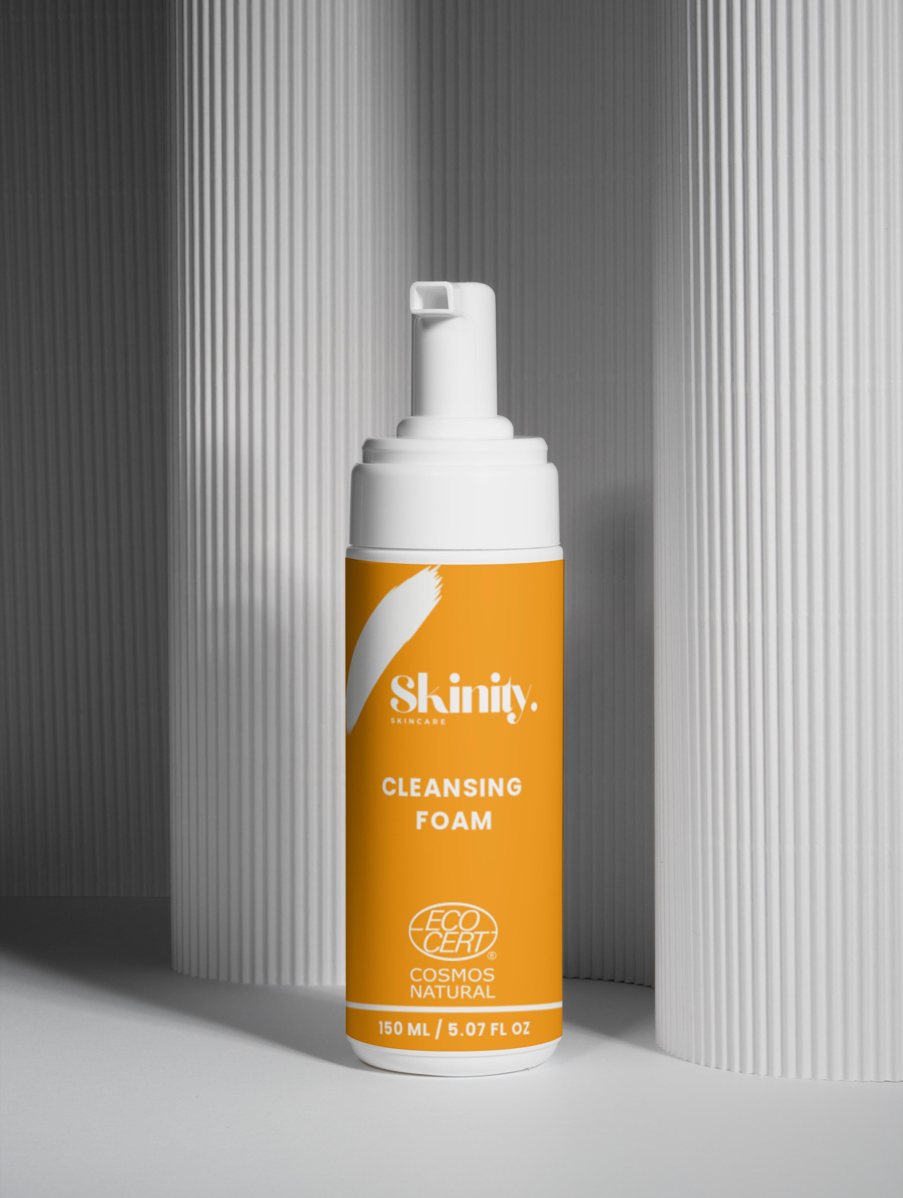 Cleansing Foam for all skincare in a sleek, modern bottle against a textured background.
