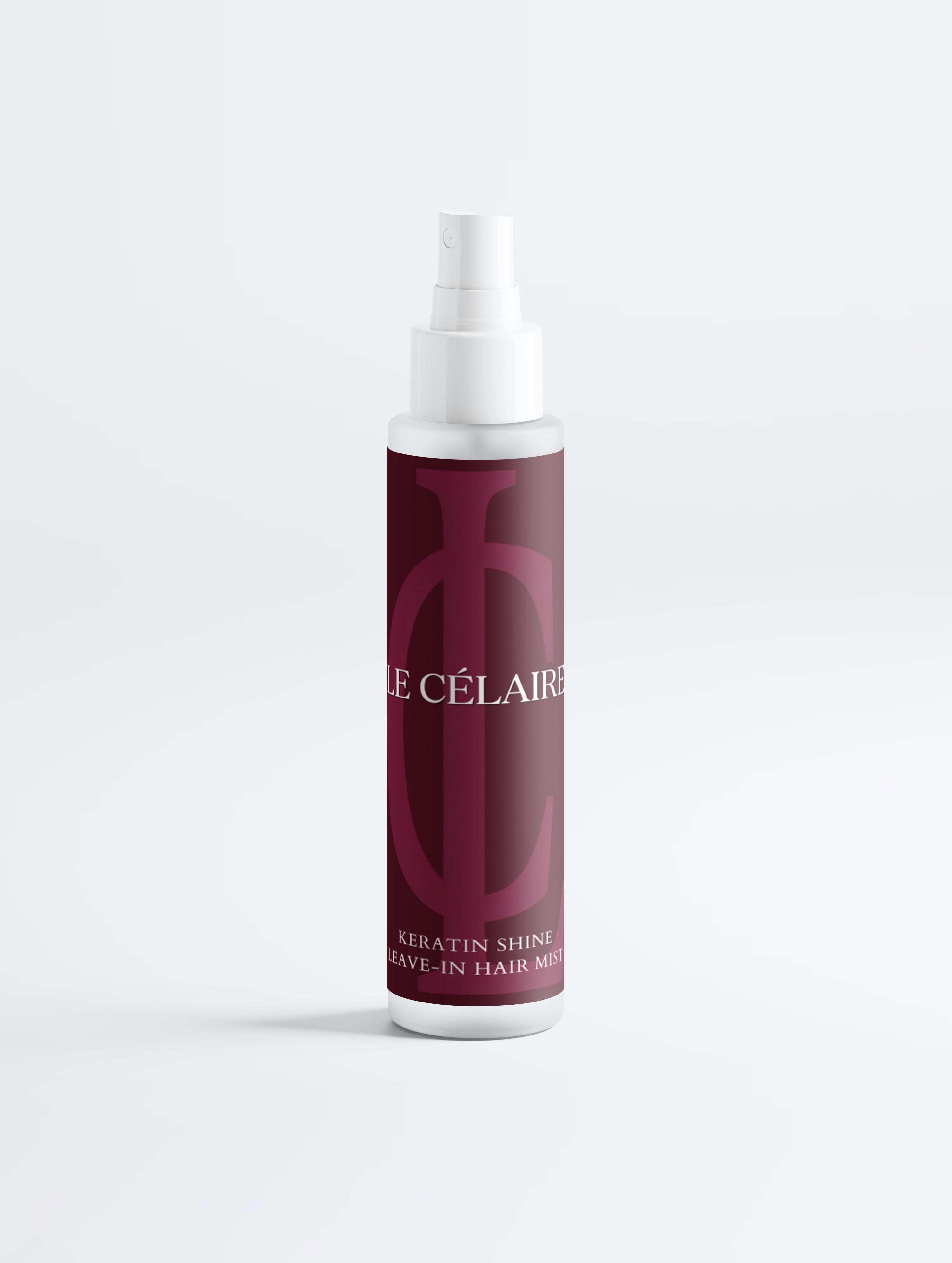 Hair mist bottle with black label on a white background