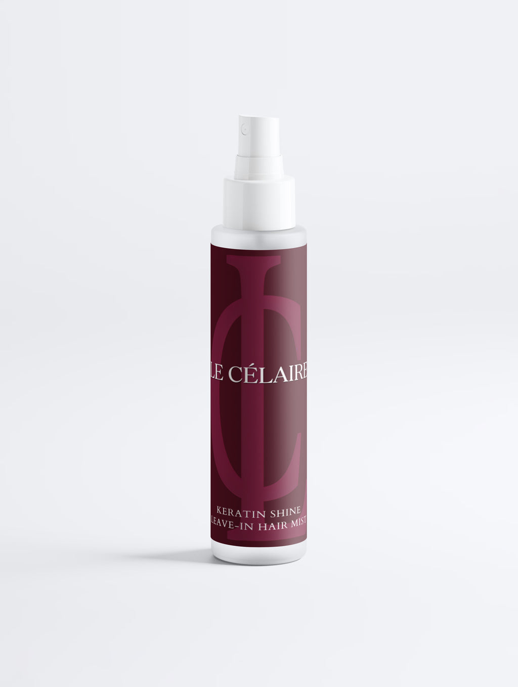 Hair mist bottle with black label on a white background