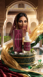 Le Célérale Royal Mask & Scalp Hair Growth Serum and its box displayed on an ornate pedestal, with a model in traditional Moroccan attire in the background and gold and green drapery.