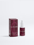 Le Célaire Targeted Dark Spot Care 1% KOJC Acid treatment shown with its dark burgundy box and matching pump bottle on a clean white background.