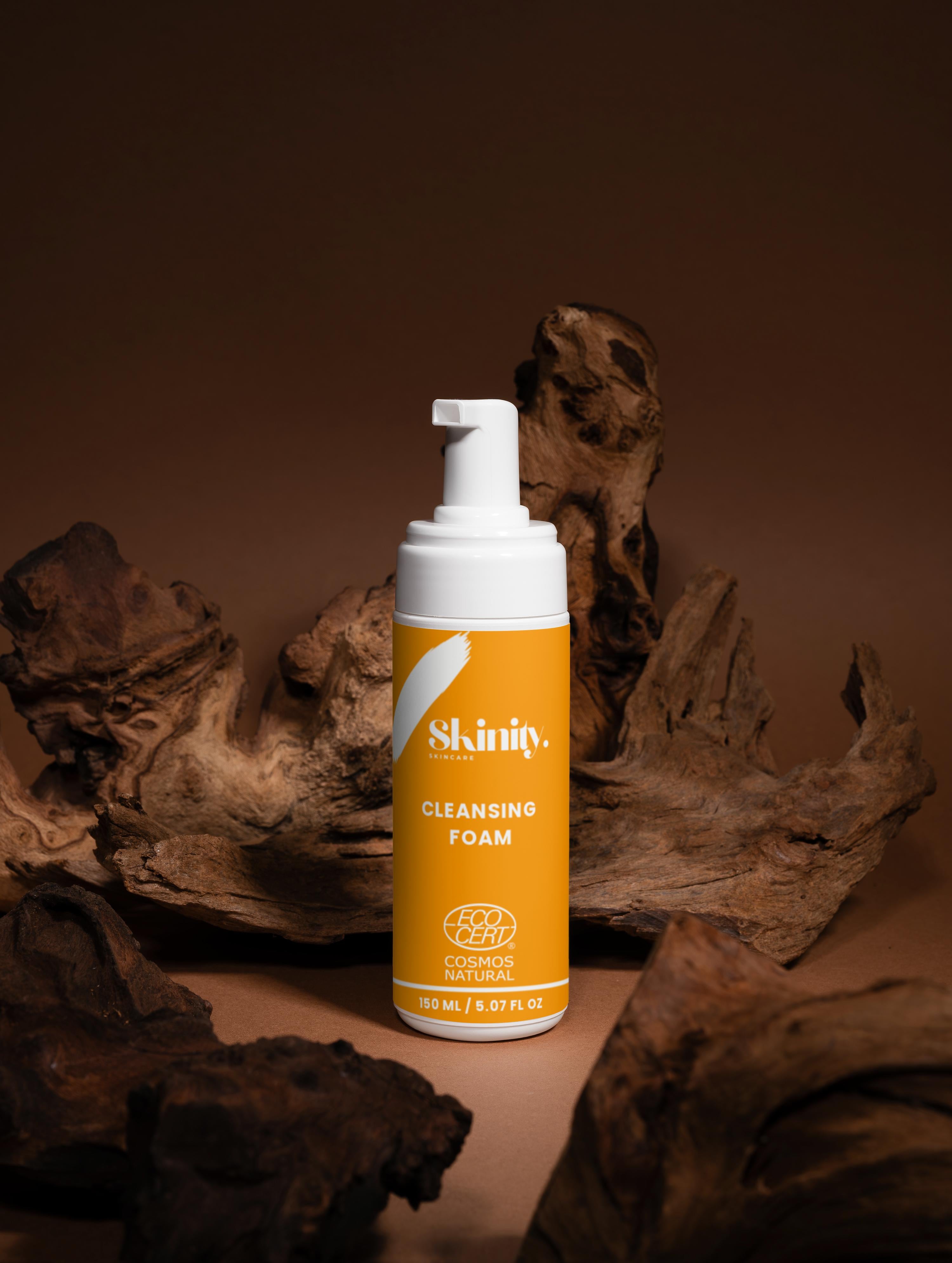 Cleansing Foam for all skincare in a pump bottle on a wooden background, perfect for purifying skin.