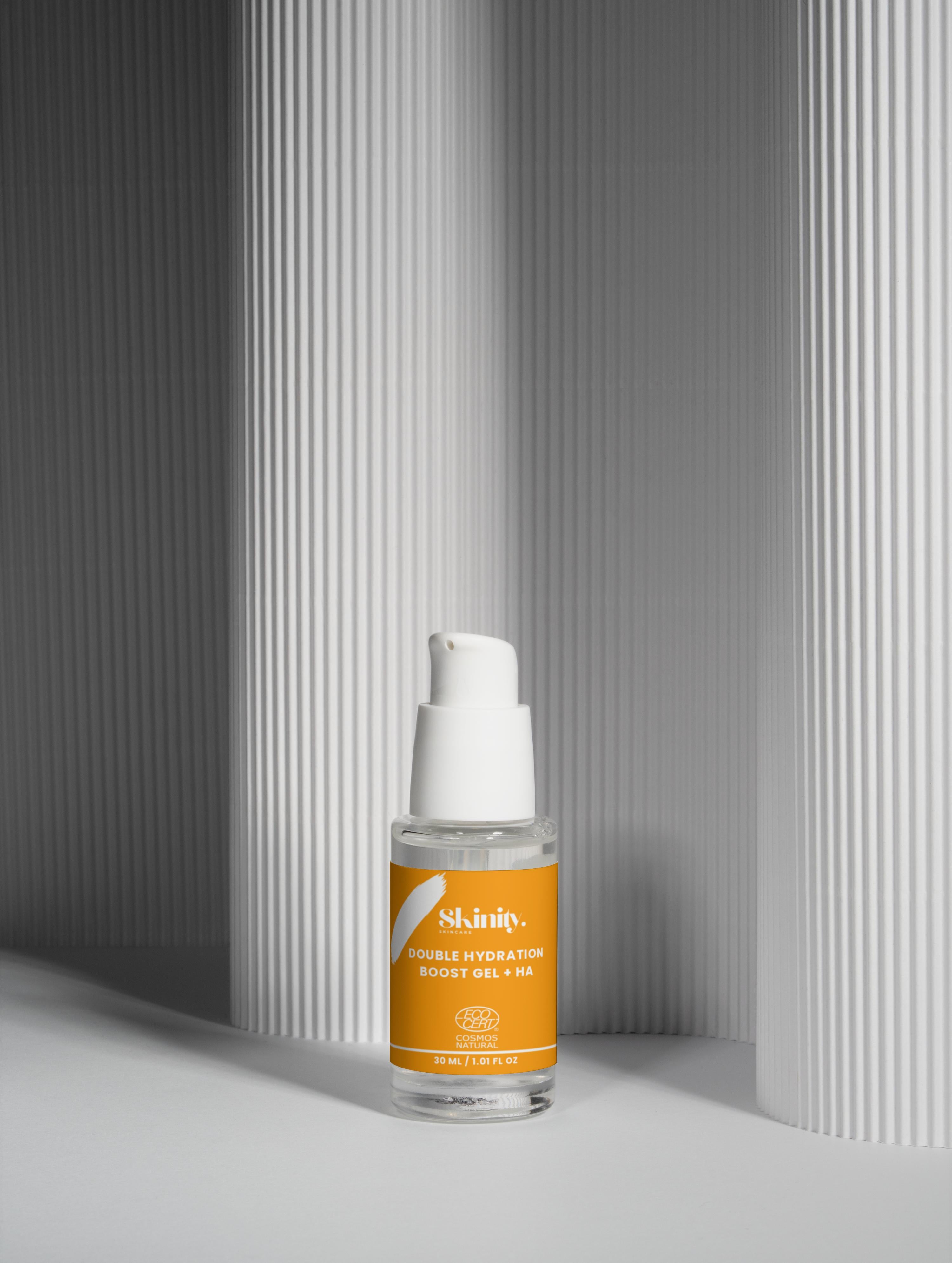 Double Hydration Boost Gel + HA bottle on a textured background, showcasing a skincare solution for deep hydration.