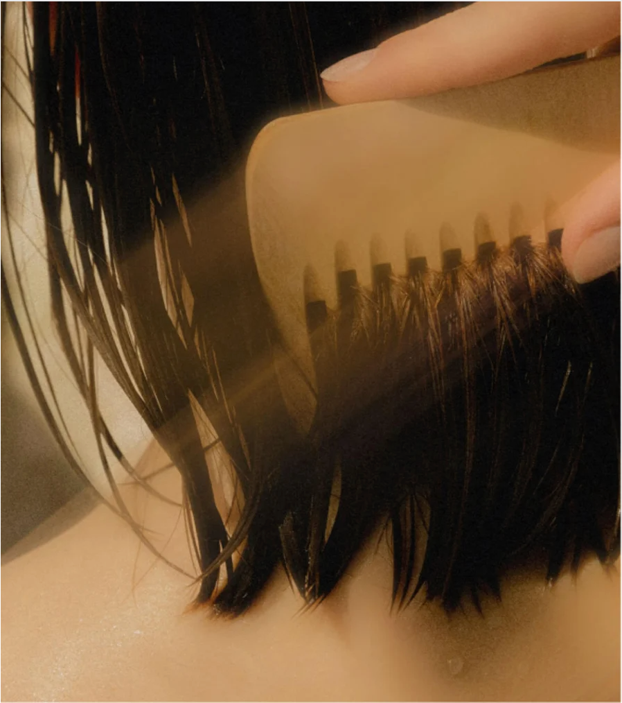 Moisturising Conditioner for all Hair types applied during hair care routine for smooth and manageable hair.