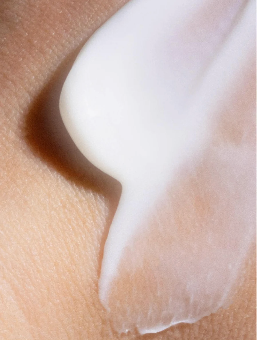 Moisturising Day Cream For All Skin applied to skin, showcasing its creamy texture and hydrating properties.