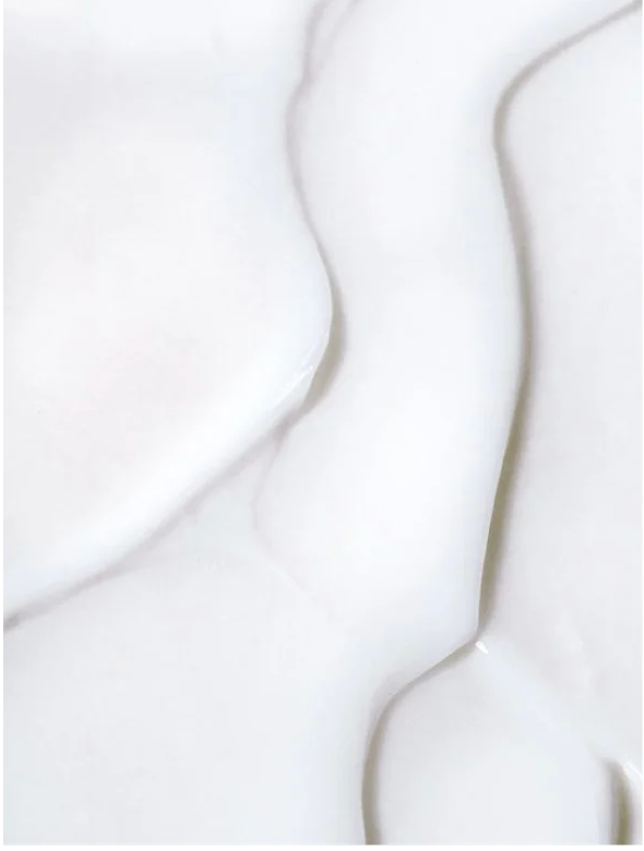Silk Skin Body Serum Spices and Sandalwood texture on a smooth surface, showcasing its lightweight and nourishing properties.