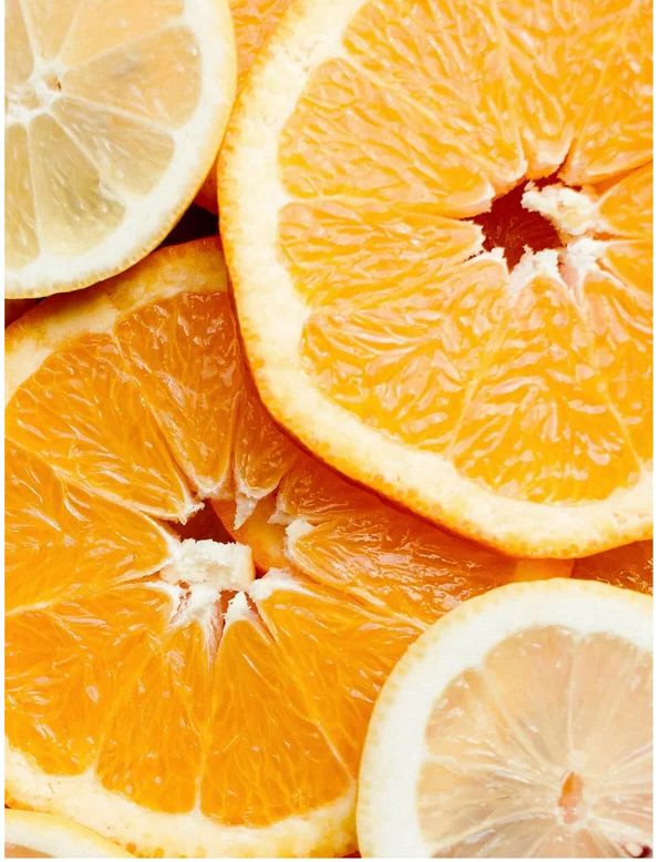 Close-up of fresh orange and lemon slices displaying vibrant colors and textures.