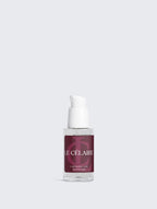Skincare serum bottle with dropper on a light gray background