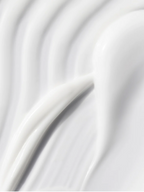 Close-up of Skinity Blemish Care Moisturiser smooth white cream texture for acne-prone skin.