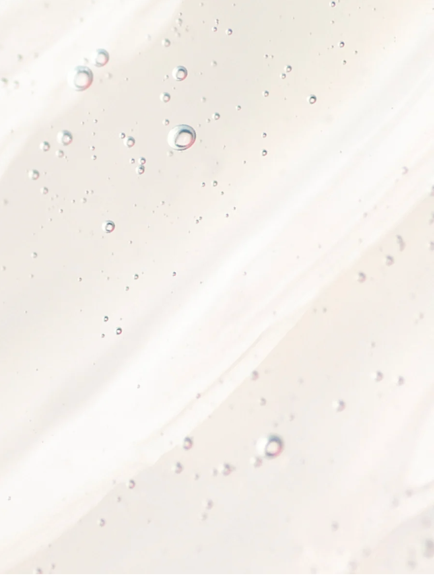 AHA Peeling Concentrate For Skin texture with bubbles, showcasing its exfoliating and rejuvenating properties.