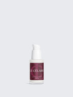 Ultra-realistic 9:16 commercial lifestyle photograph for Le Célaire Youthful Glow Hyaluronic Serum, showing the clear bottle and burgundy box on a stone plinth, an elegant woman in a sunrise lake pavilion, diamonds, elderberries, and liquid gold calligraphy.