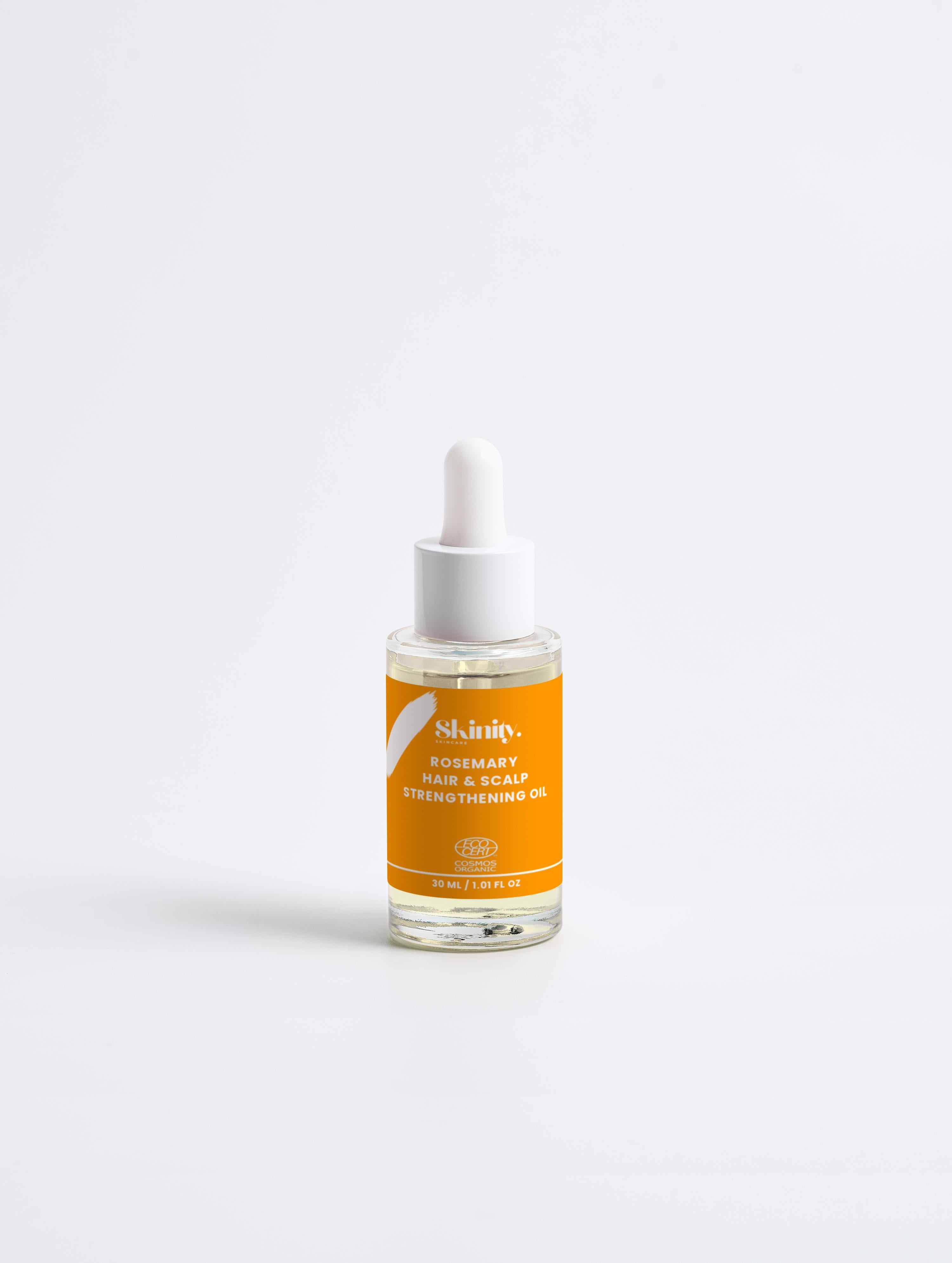 Rosemary Hair and Scalp Strengthening Oil in a dropper bottle for revitalizing hair and scalp.