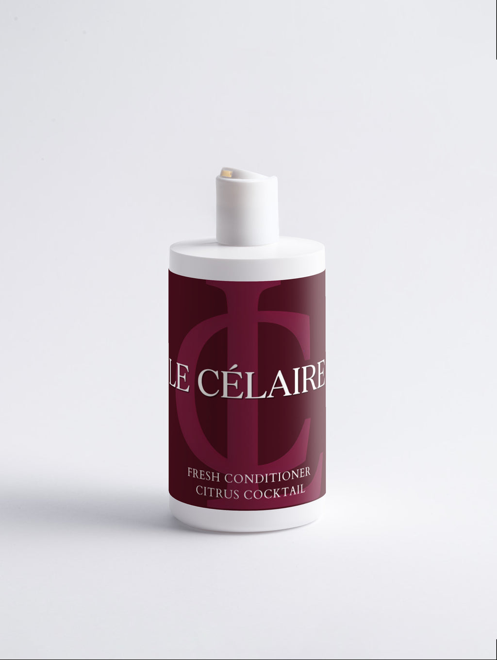 A bottle of Le Célaire Fresh Conditioner in Citrus Cocktail scent, featuring a deep burgundy label with white lettering and a white cap, set against a clean white background.