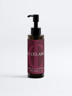 Billionaire-tier 9:16 commercial bodycare advertisement for Le Célaire Omega 6-9 Glowing Skin Body Oil, showing the amber pump bottle beside glowing model skin, organic seeds, diamonds, and an omega lipid benefit checklist.