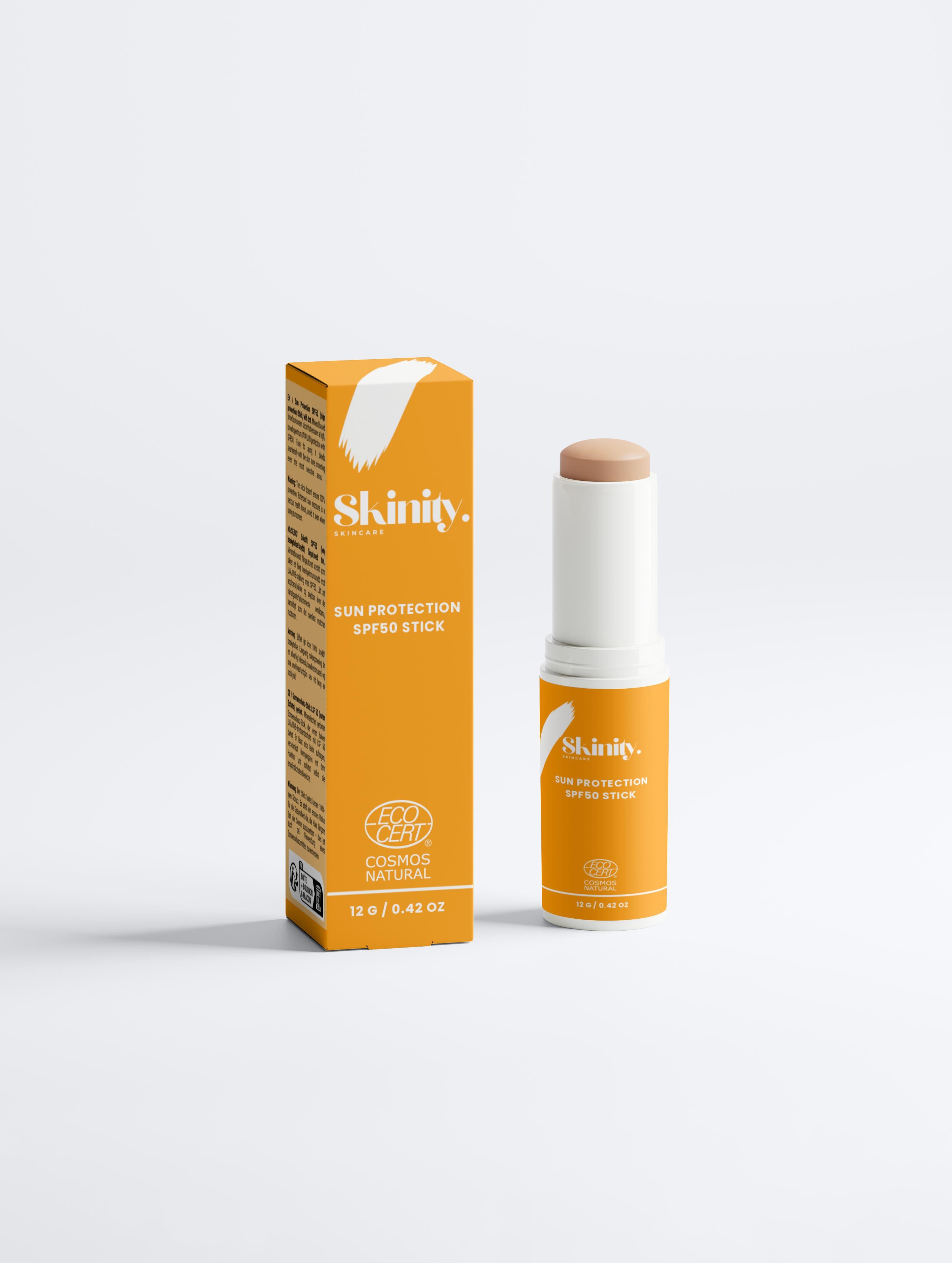 SPF 50 tinted sunscreen stick in a white tube with orange packaging for sun protection.