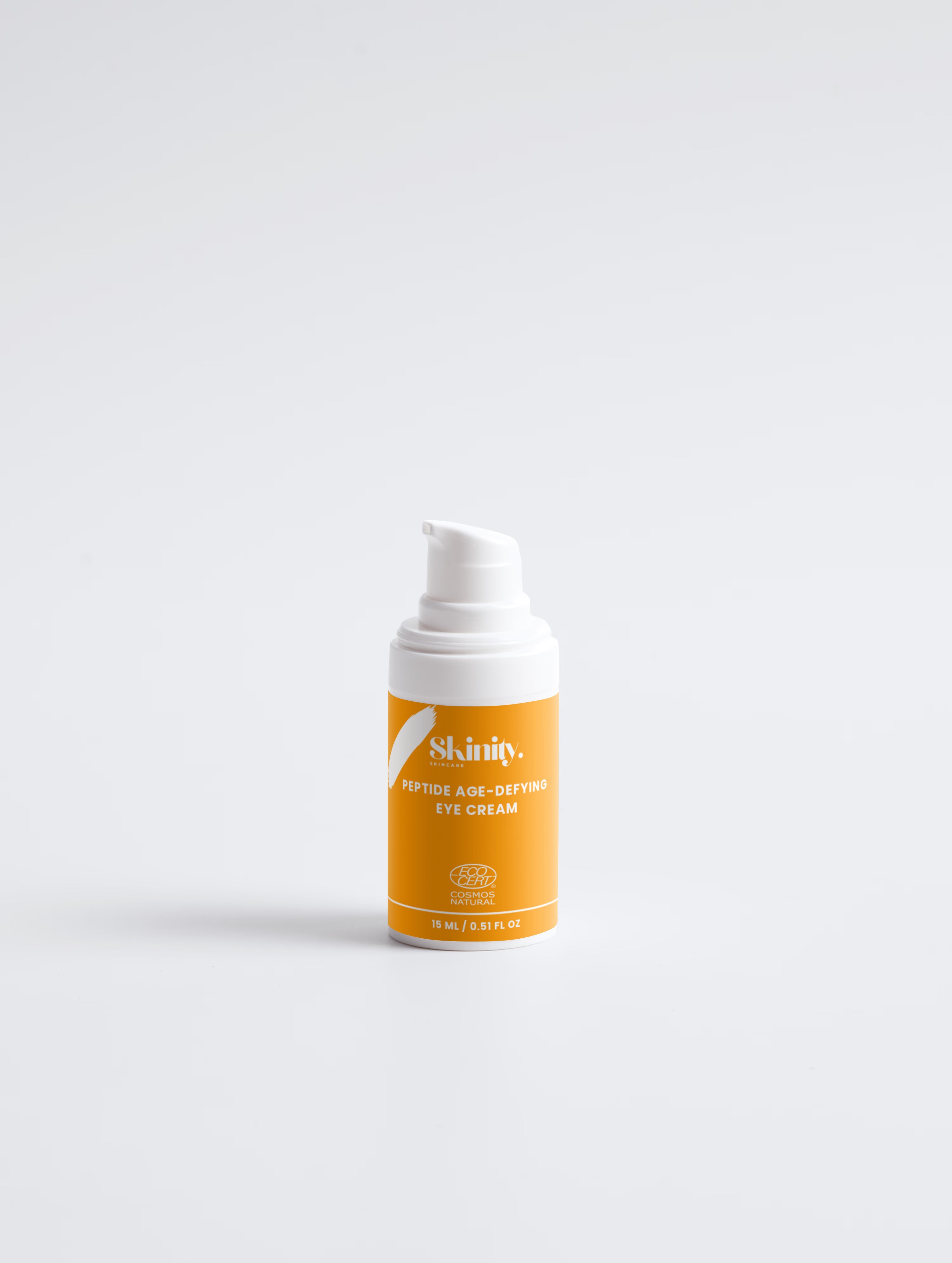 Skinity Skincare Peptide Anti Aging Eye Cream for Wrinkles and Dark Circles premium product bottle placed on an organic luxury dark wood texture background with natural greenery elements