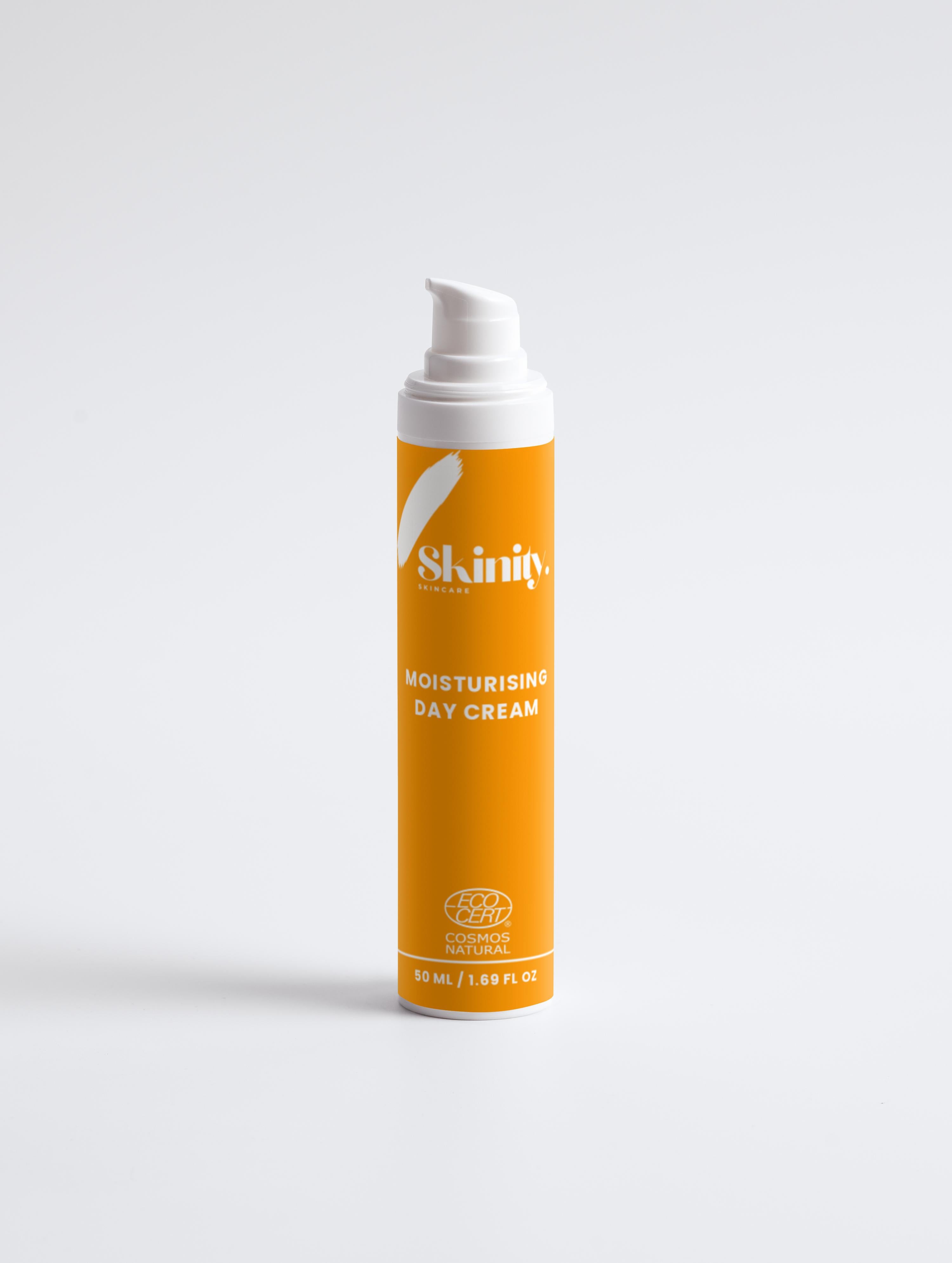 Moisturising Day Cream For All Skin in a vibrant orange pump bottle on a white background.