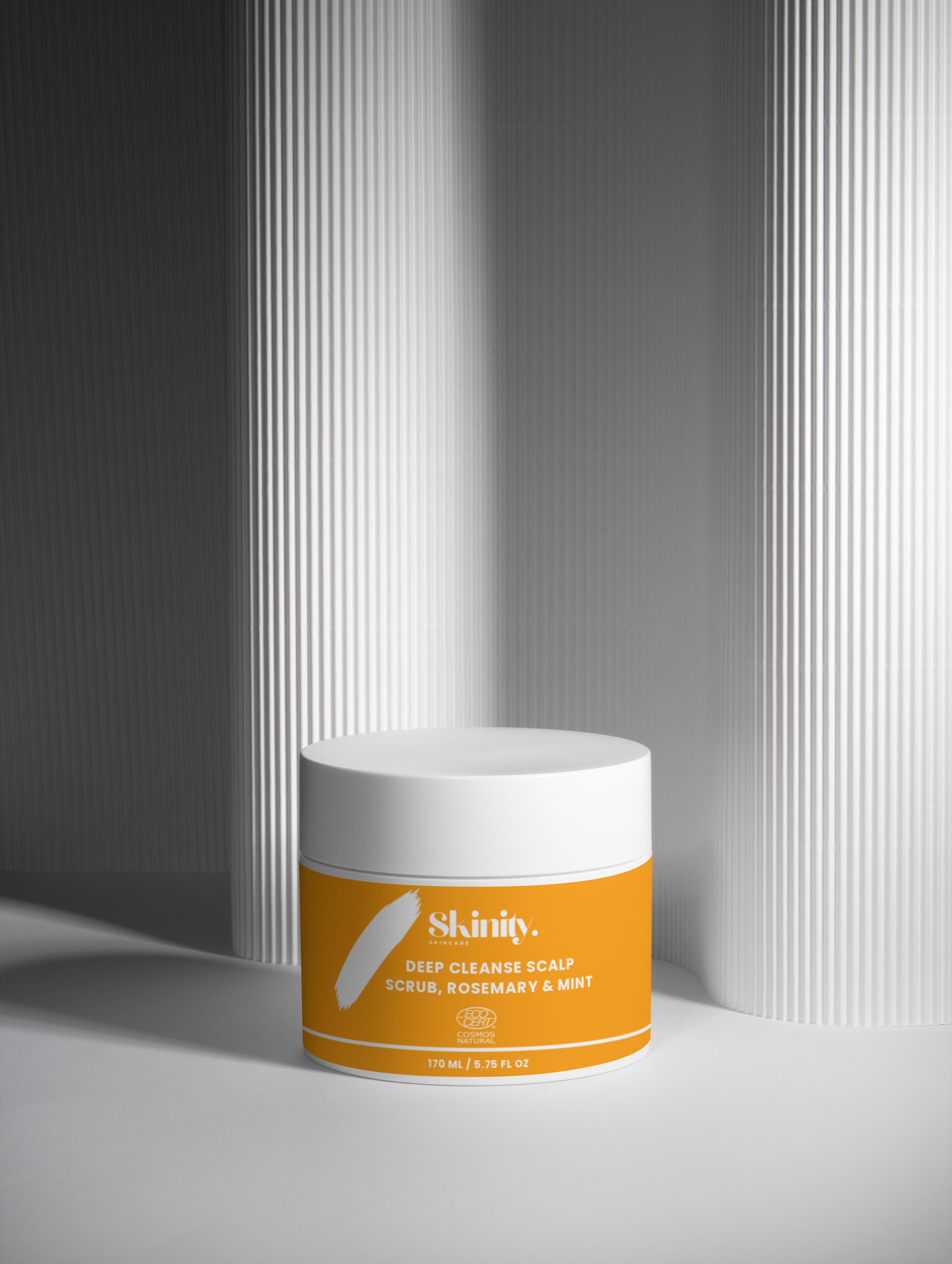 Deep Cleanse Scalp Scrub Rosemary and Mint jar on a minimalistic background, promoting healthy scalp detox.